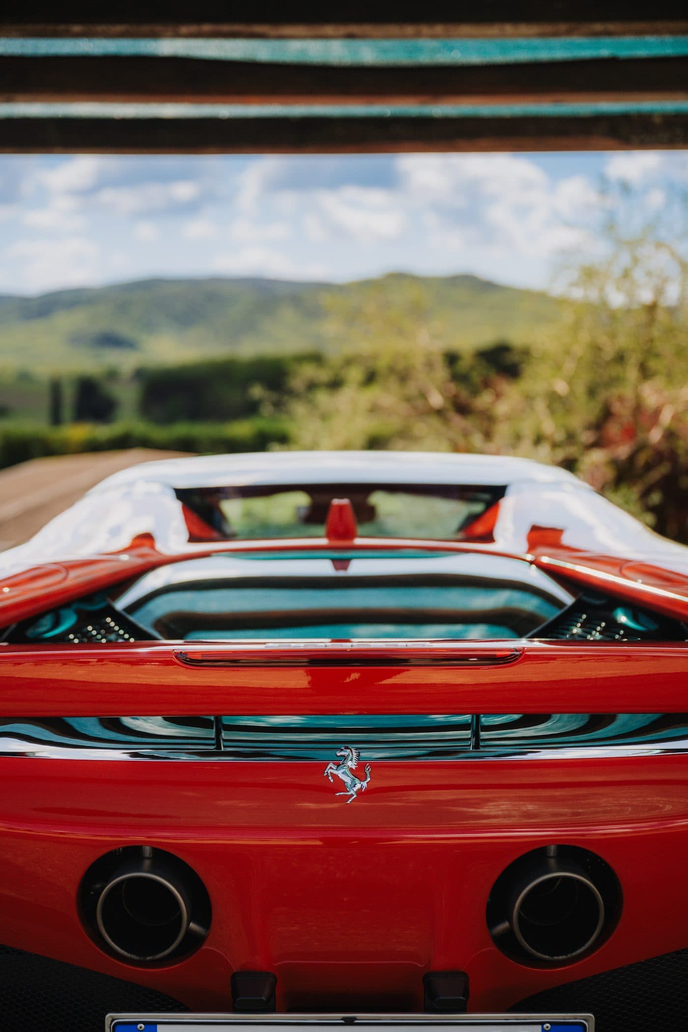 Supercar among Tuscan cypresses
